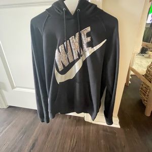 Nike Wome’ns hoodie. Size Large. Black with silver sparkly Nike logo.
